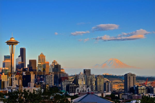 A view of a city with a mountain in the background